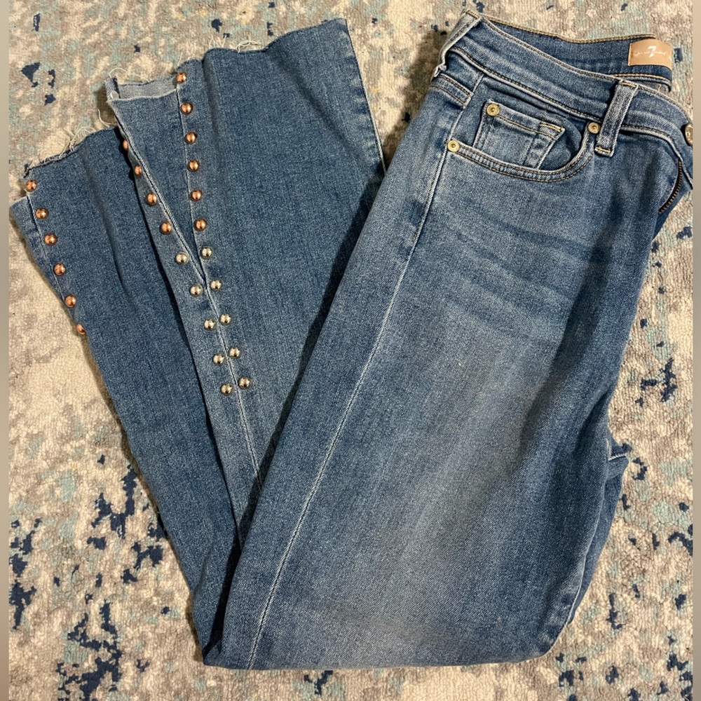 7 For All Mankind Blue Jeans with studded flared bottoms. Size 27.